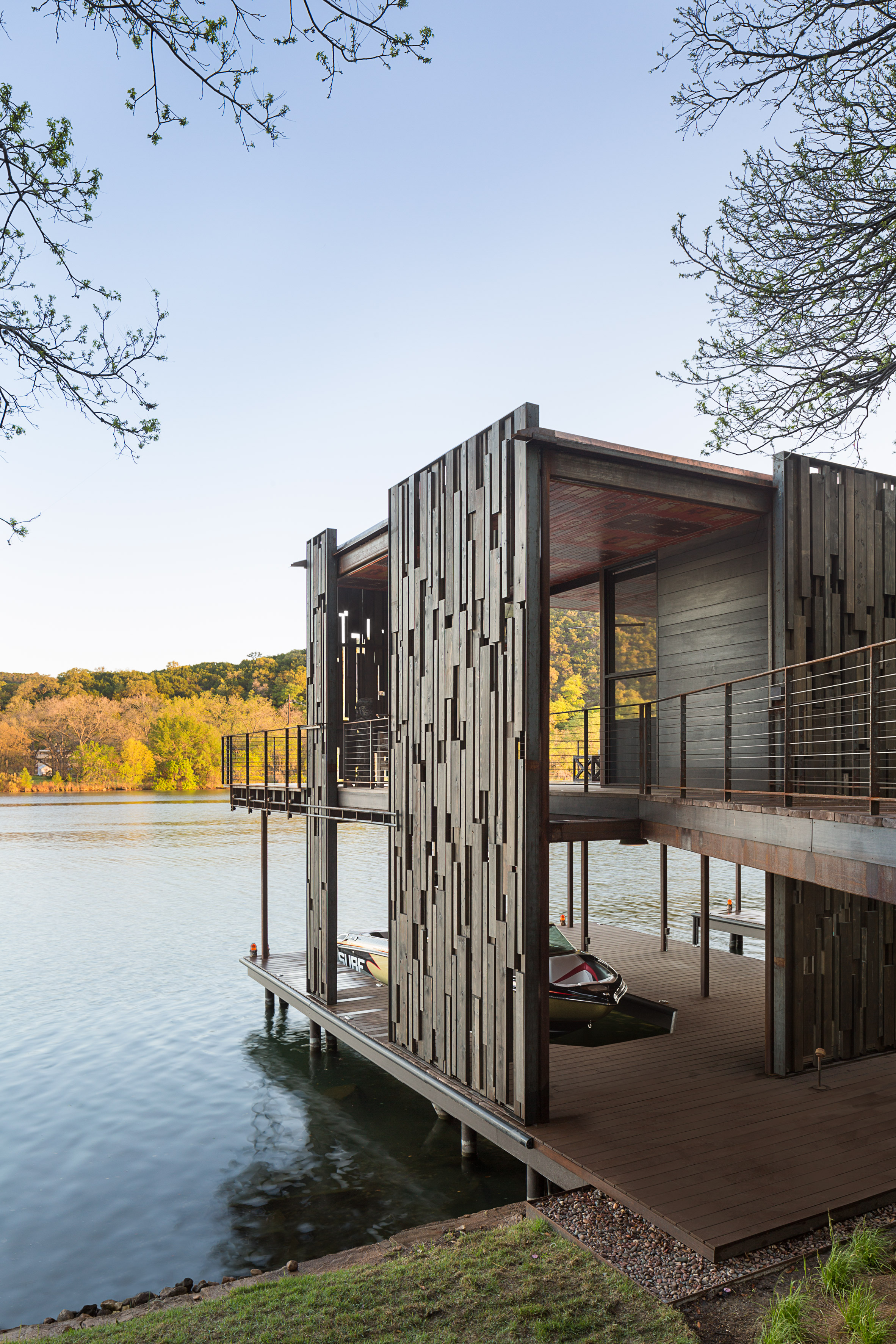 s new and salvaged materials into rustic austin boathouse