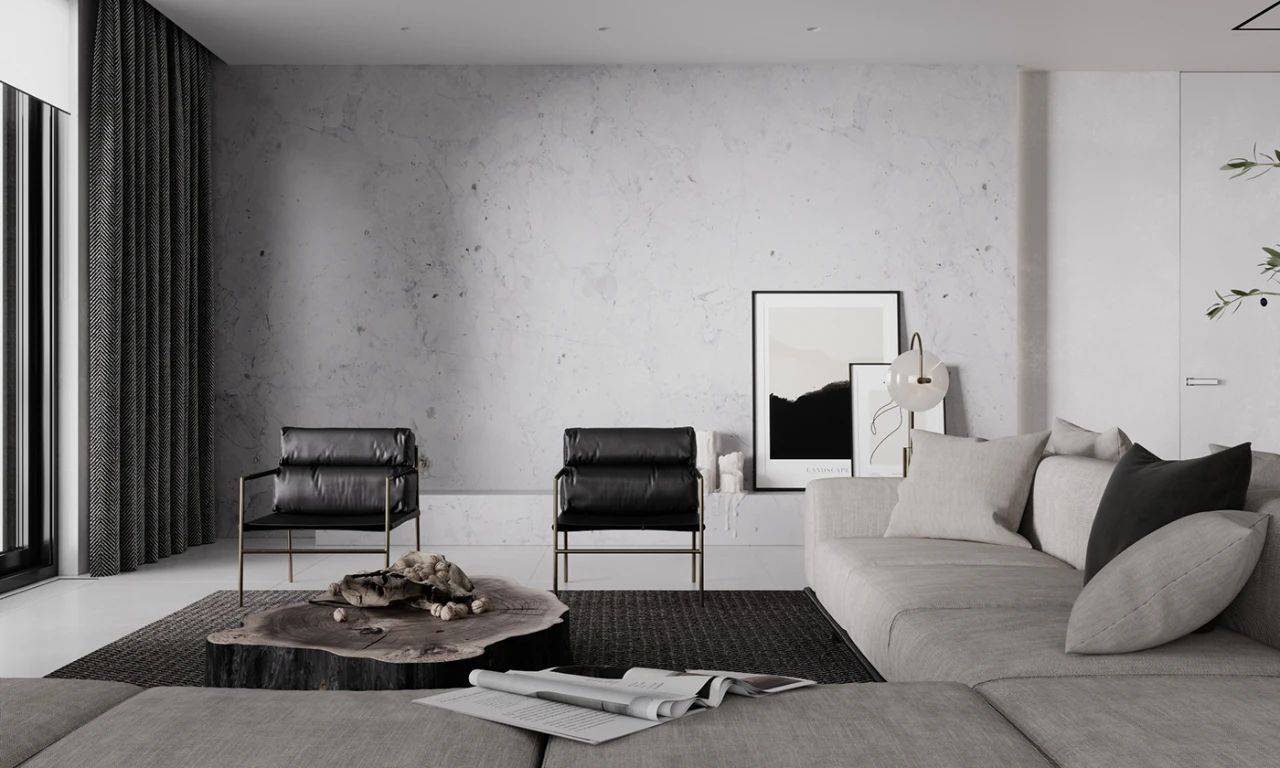 首先映入眼帘的,是冷静而素雅的客厅,大面积的浅白色水泥墙作为主色调
